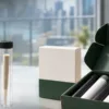 Unbranded single pre-roll tubes beside a multi-pack box on a clean delivery workspace